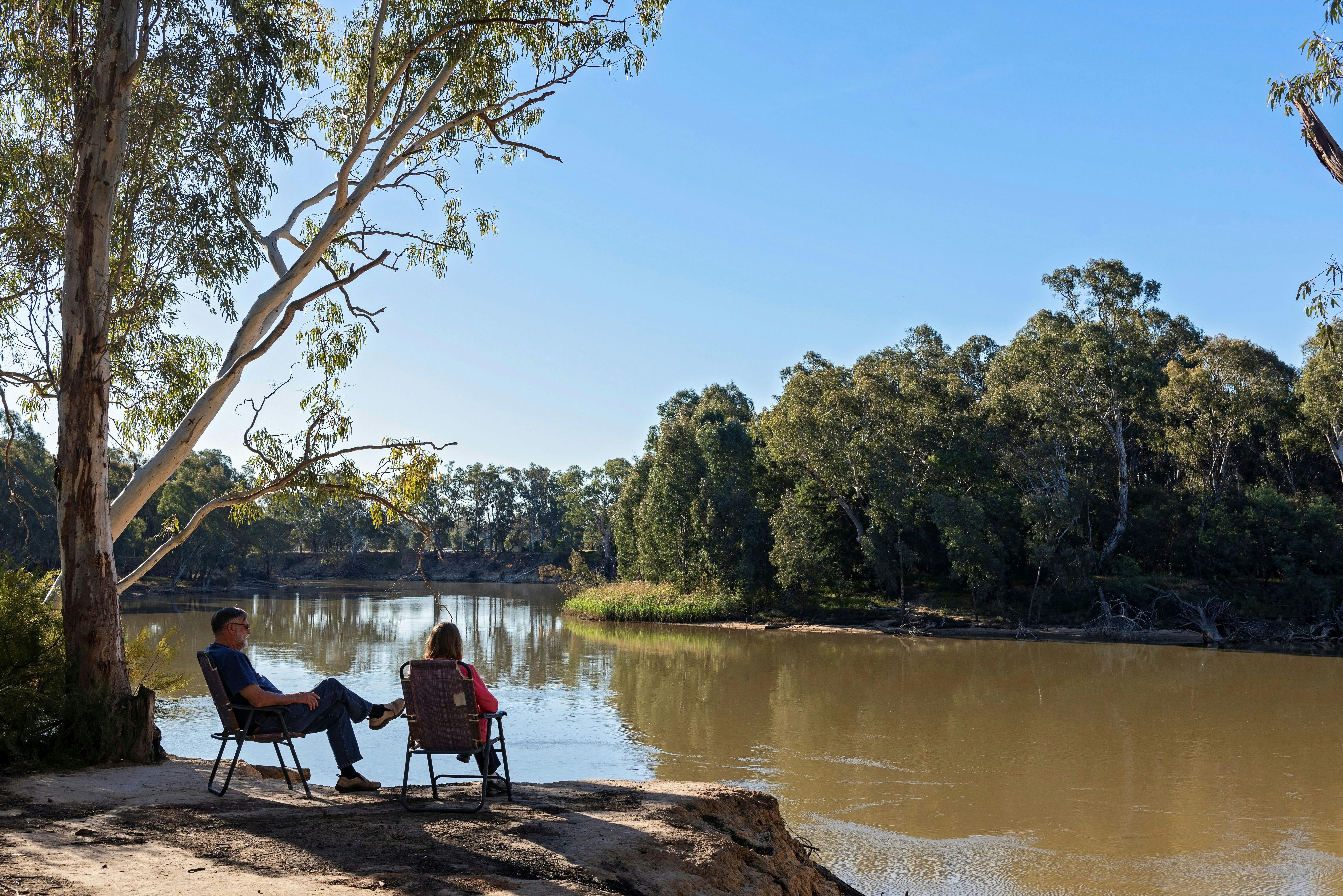 Couple sitting by the lake. Discovery Parks - Echuca