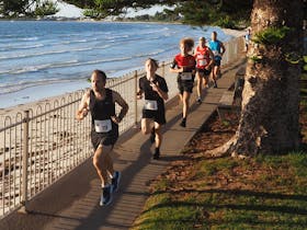 Participants in the fun run wear official timers for accuracy.