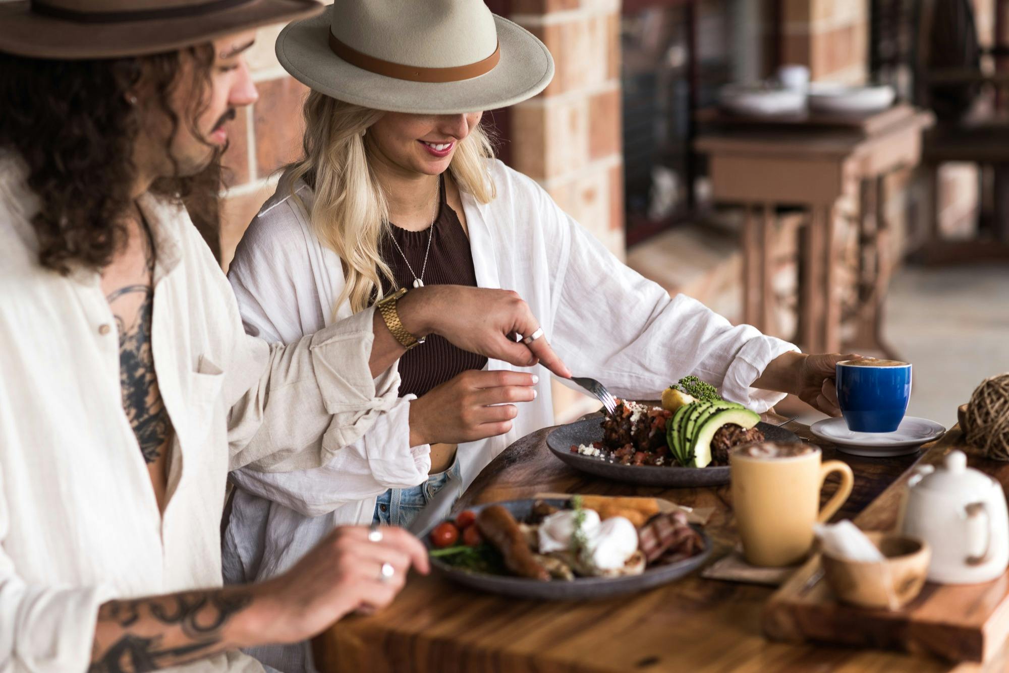 Couple Enjoying Breakfast outside Accommodation Lodge