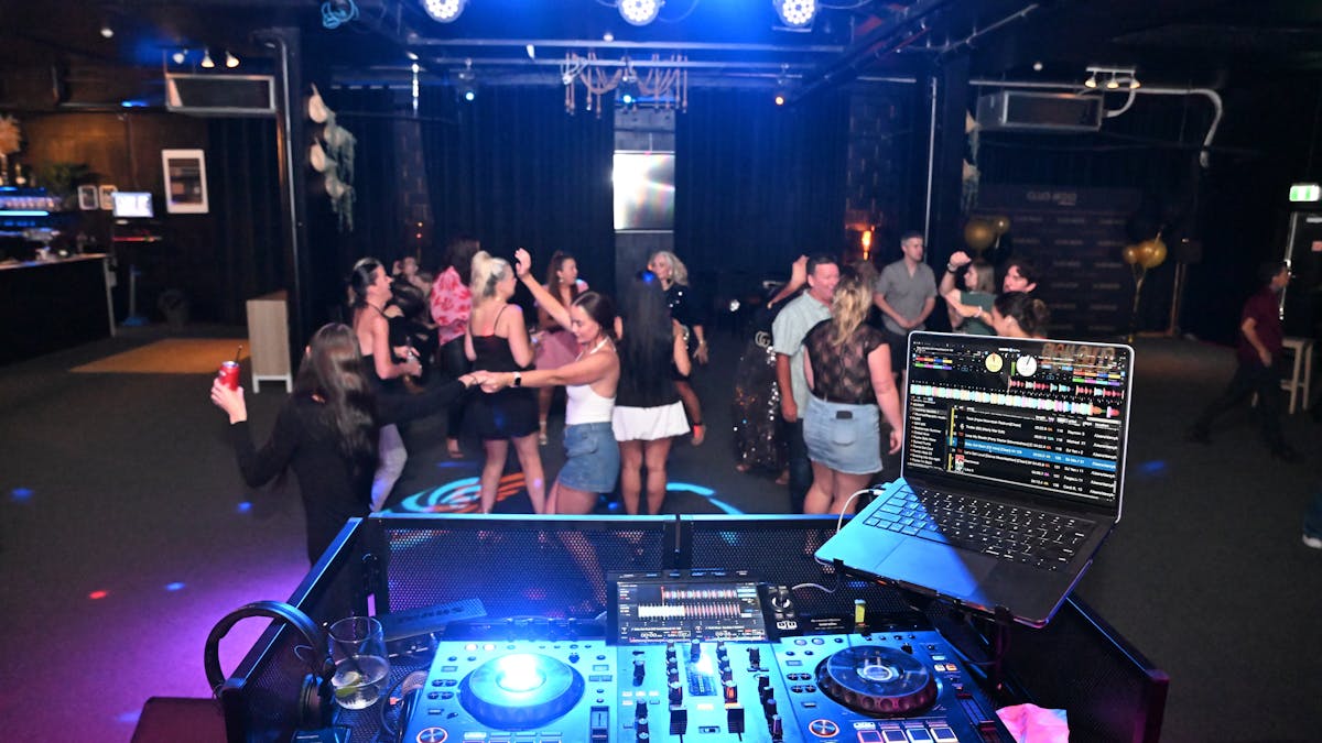 People Dancing Infront of DJ Deck at Club Noir