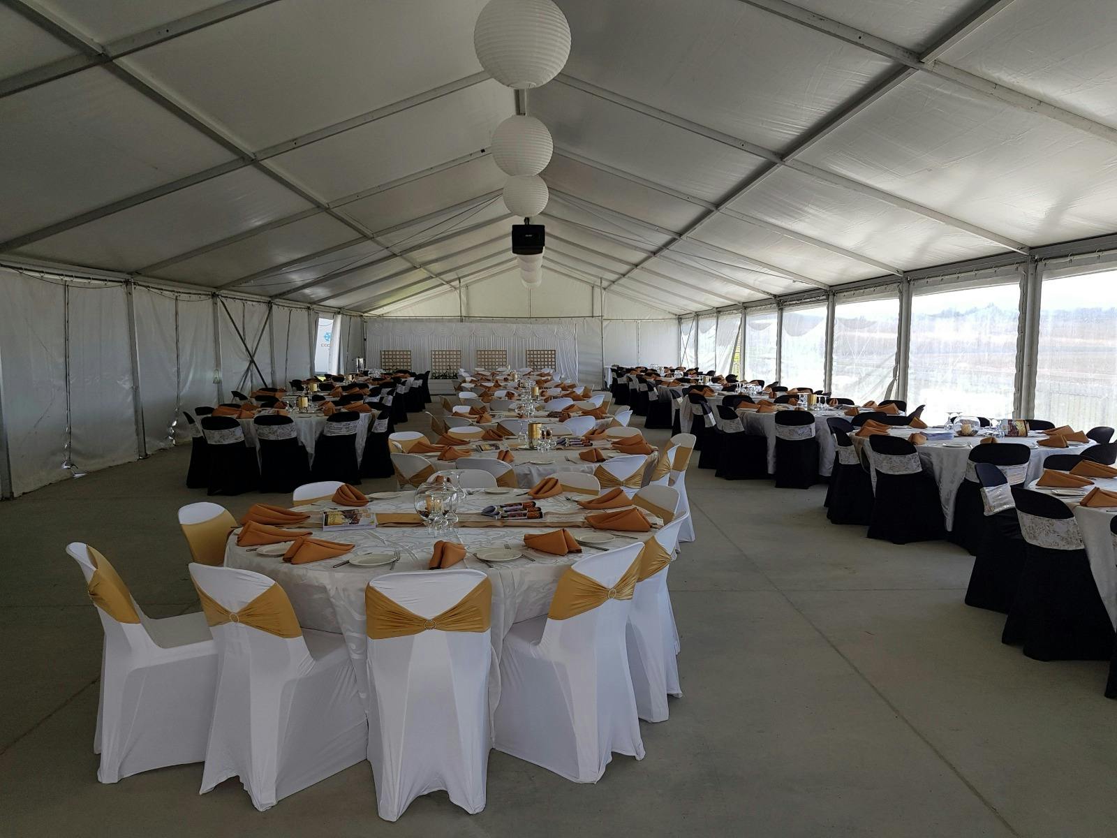 marquee, formal dining, white chairs, round tables, chair sashes