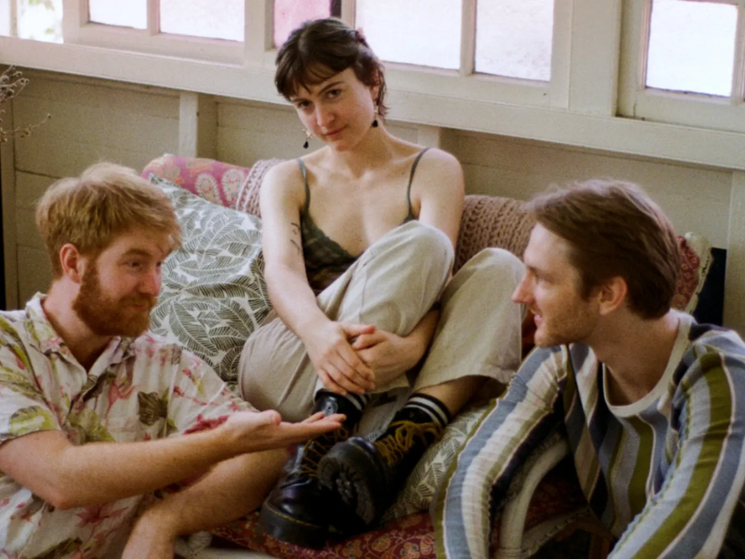 Band sitting together in a nice warm lit room