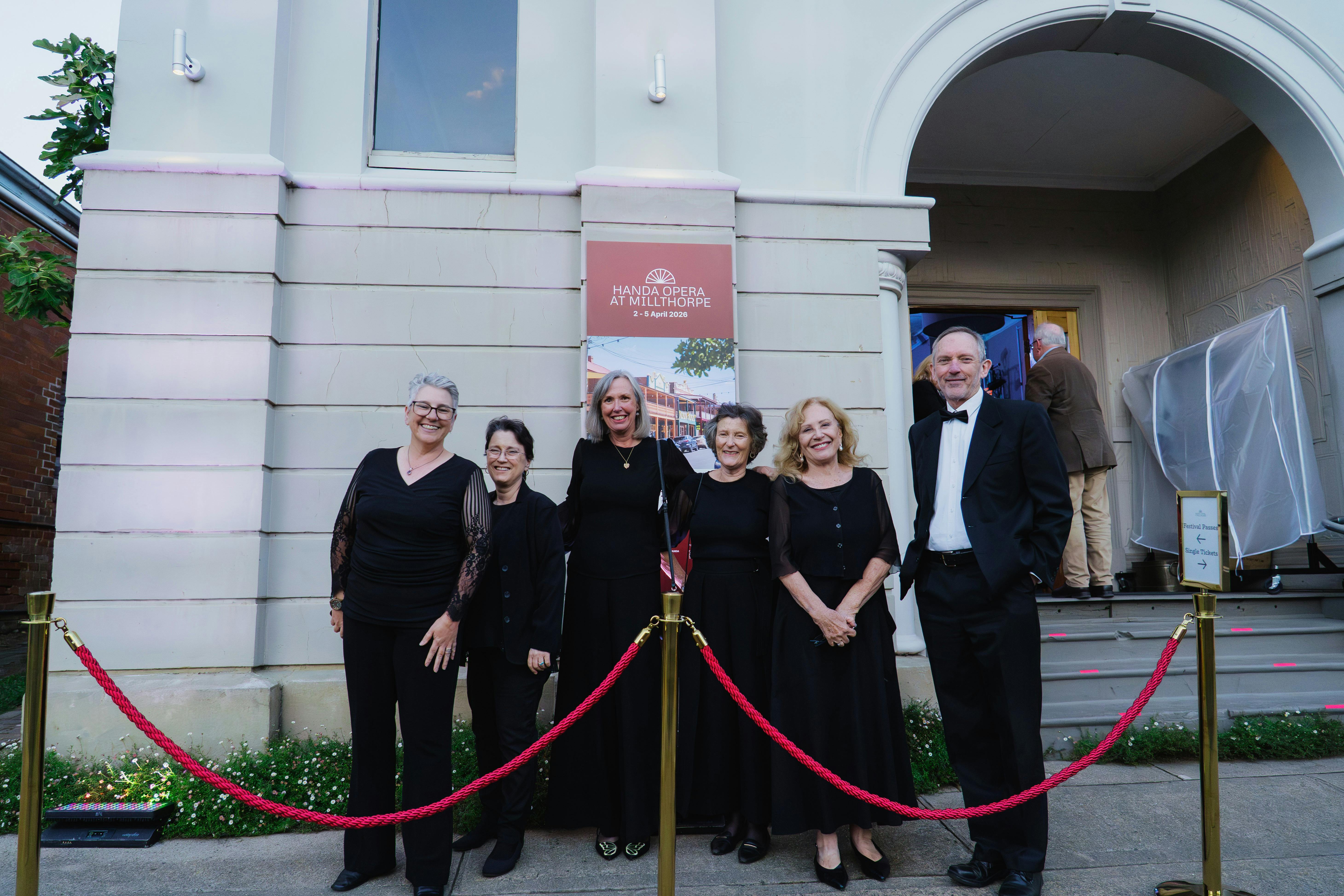 Audience members smile outside the Millthorpe Hall