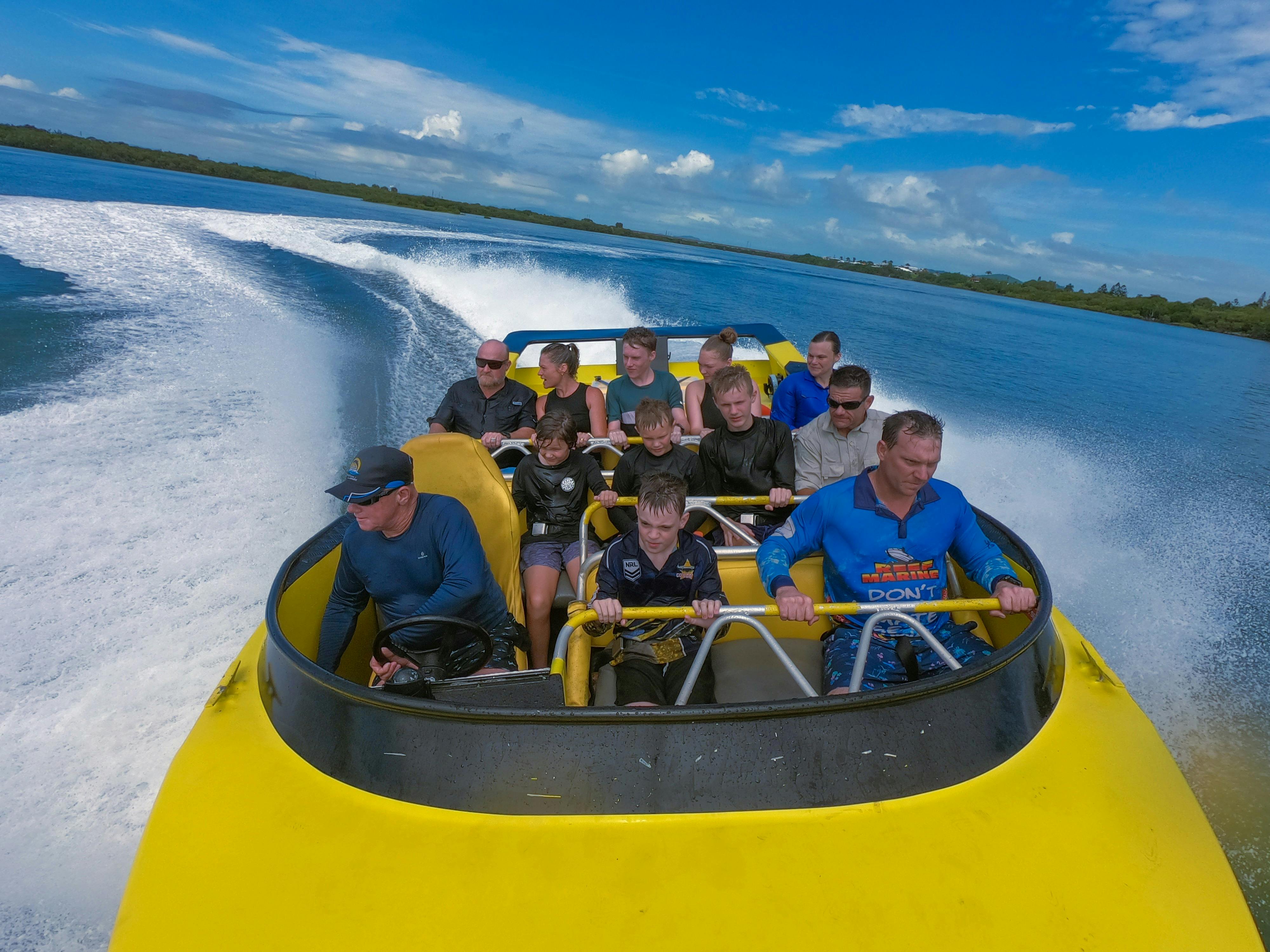 Passengers enjoying jet boat ride