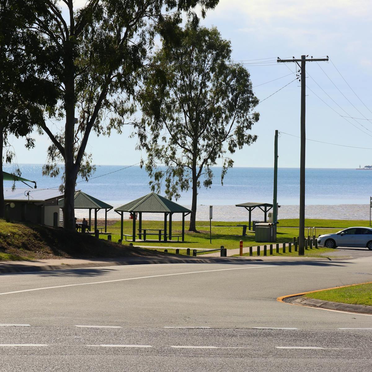 The bright blue southern bayside can be seen through the trees from the Pantry's verandah.