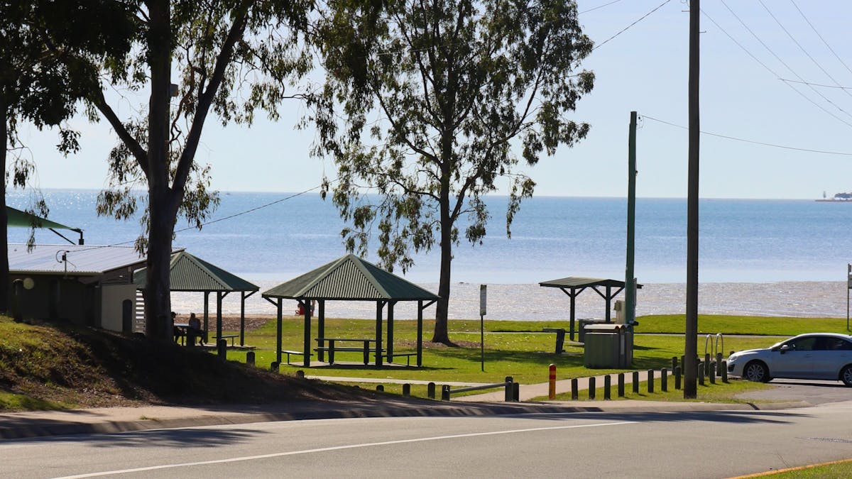 The bright blue southern bayside can be seen through the trees from the Pantry's verandah.