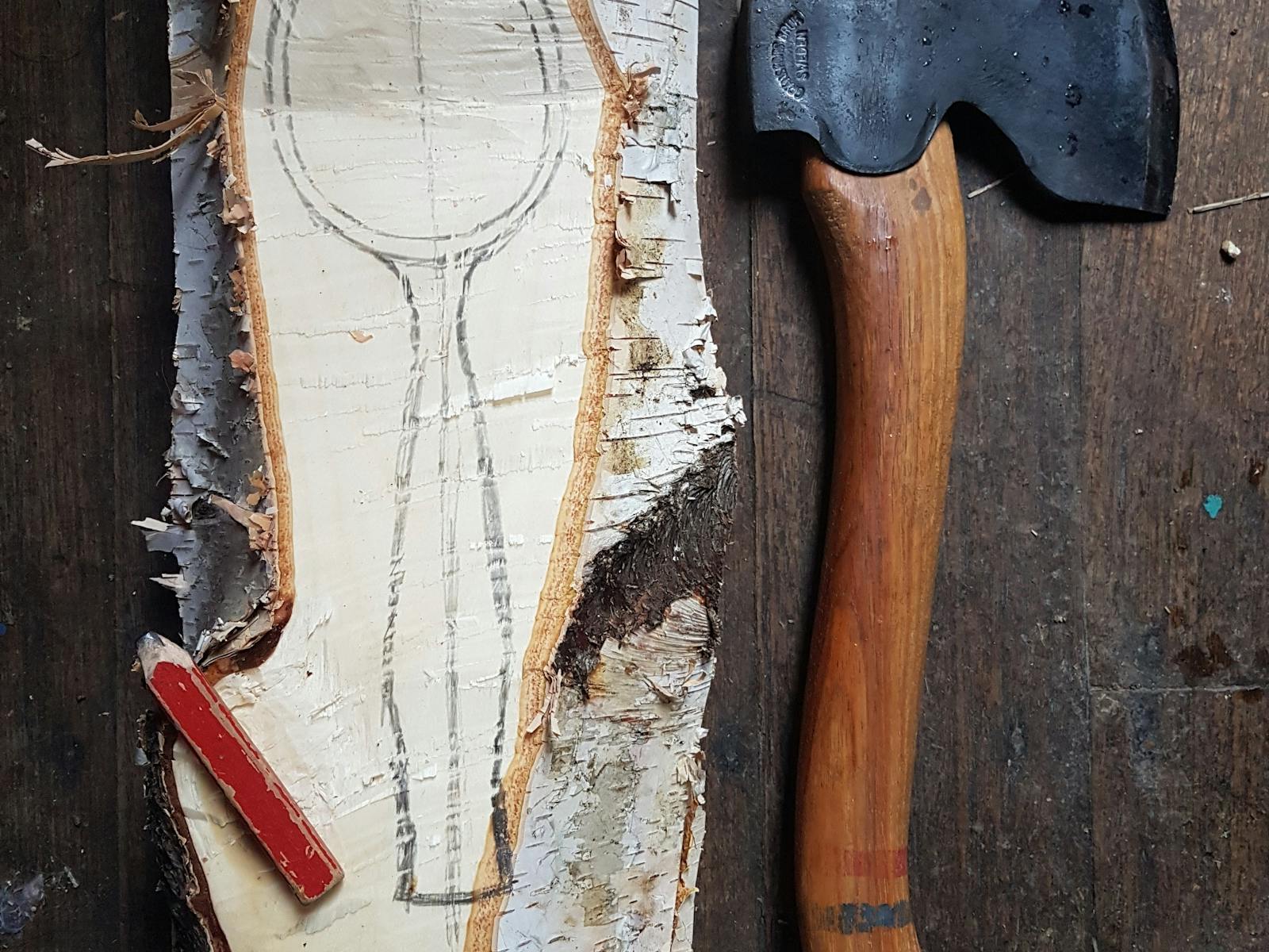 Salvage birch log being transformed into a spoon