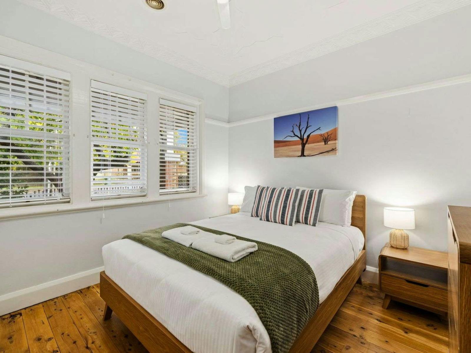 Queen bedroom with side tables, drawers