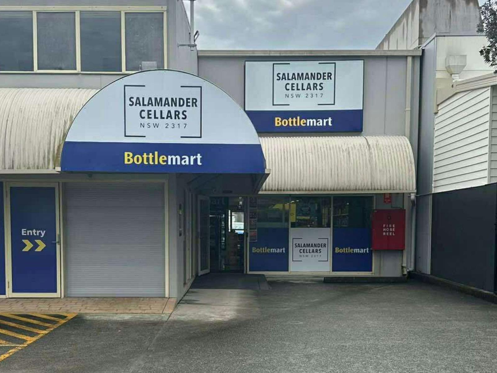 front entrance to Salamander Cellars with a BottleMart sign in and logo