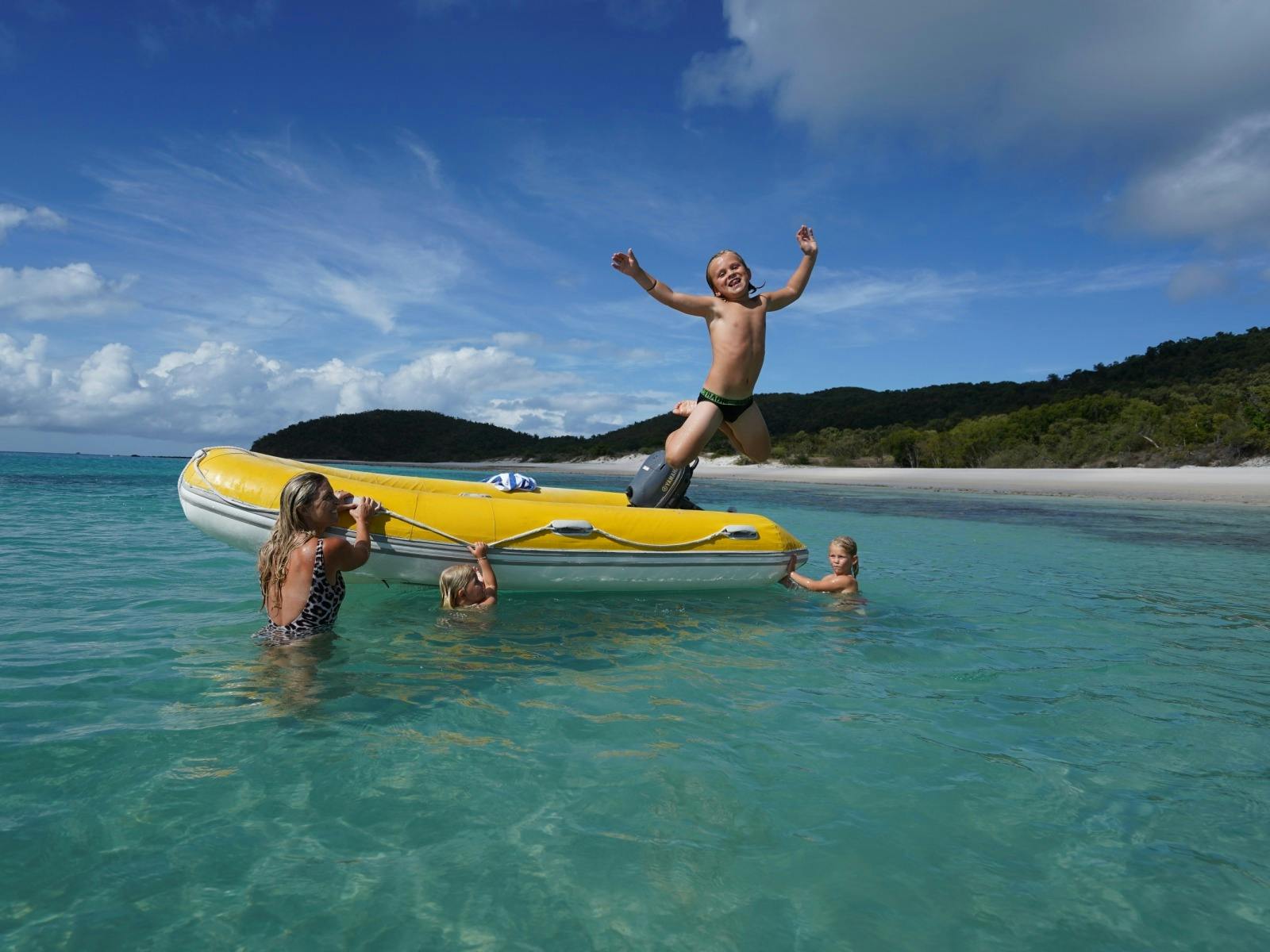 Kids having fun Whitehaven Beach swimming tender Kids having fun Whitehaven Beach swimming tender