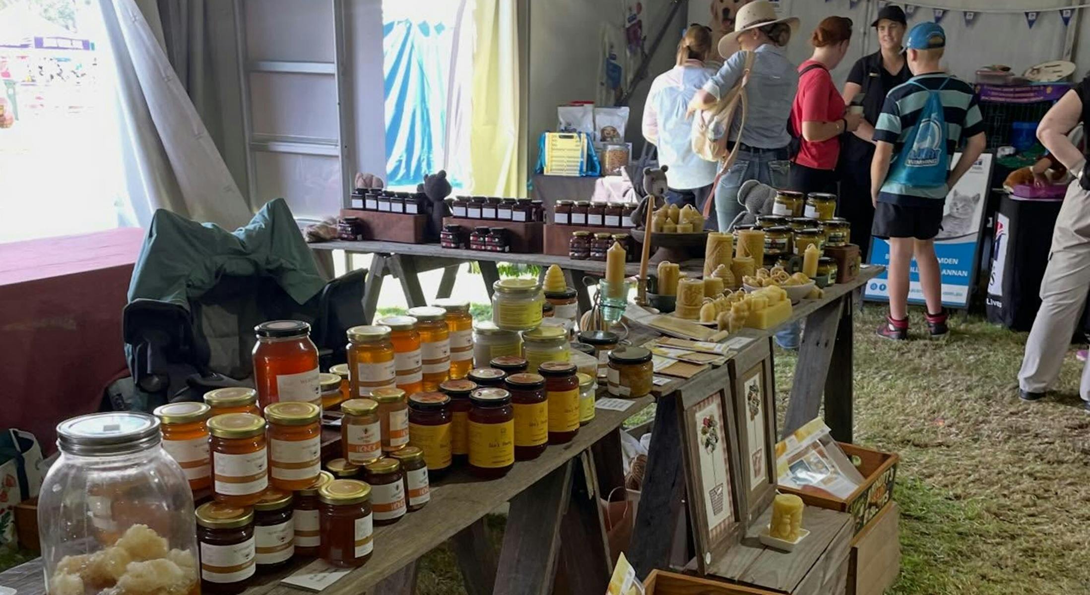 Honey Merch display at a market