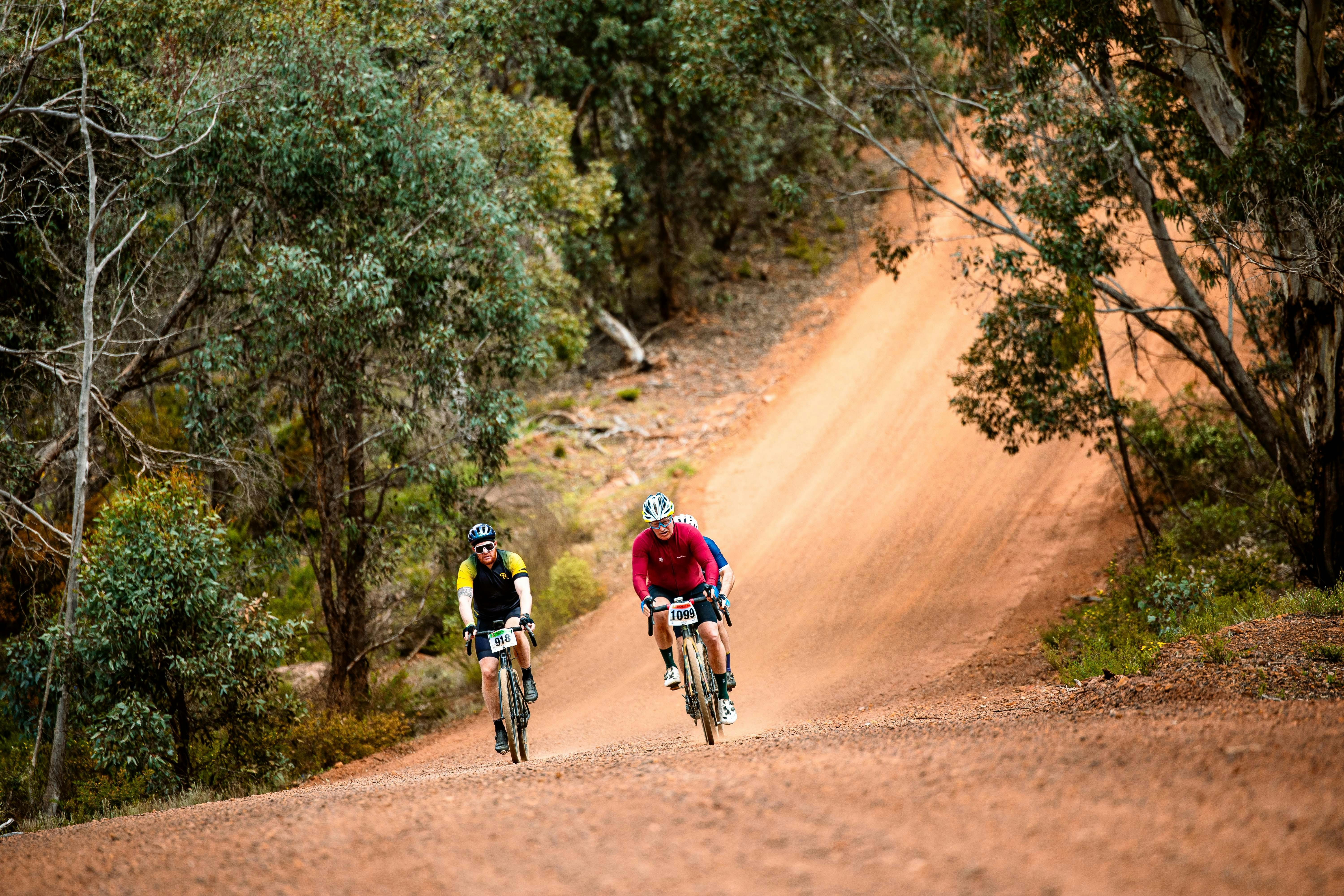 2 gravel riders going up hill