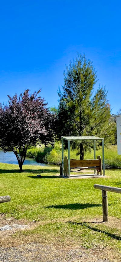 Open grassed area beside river