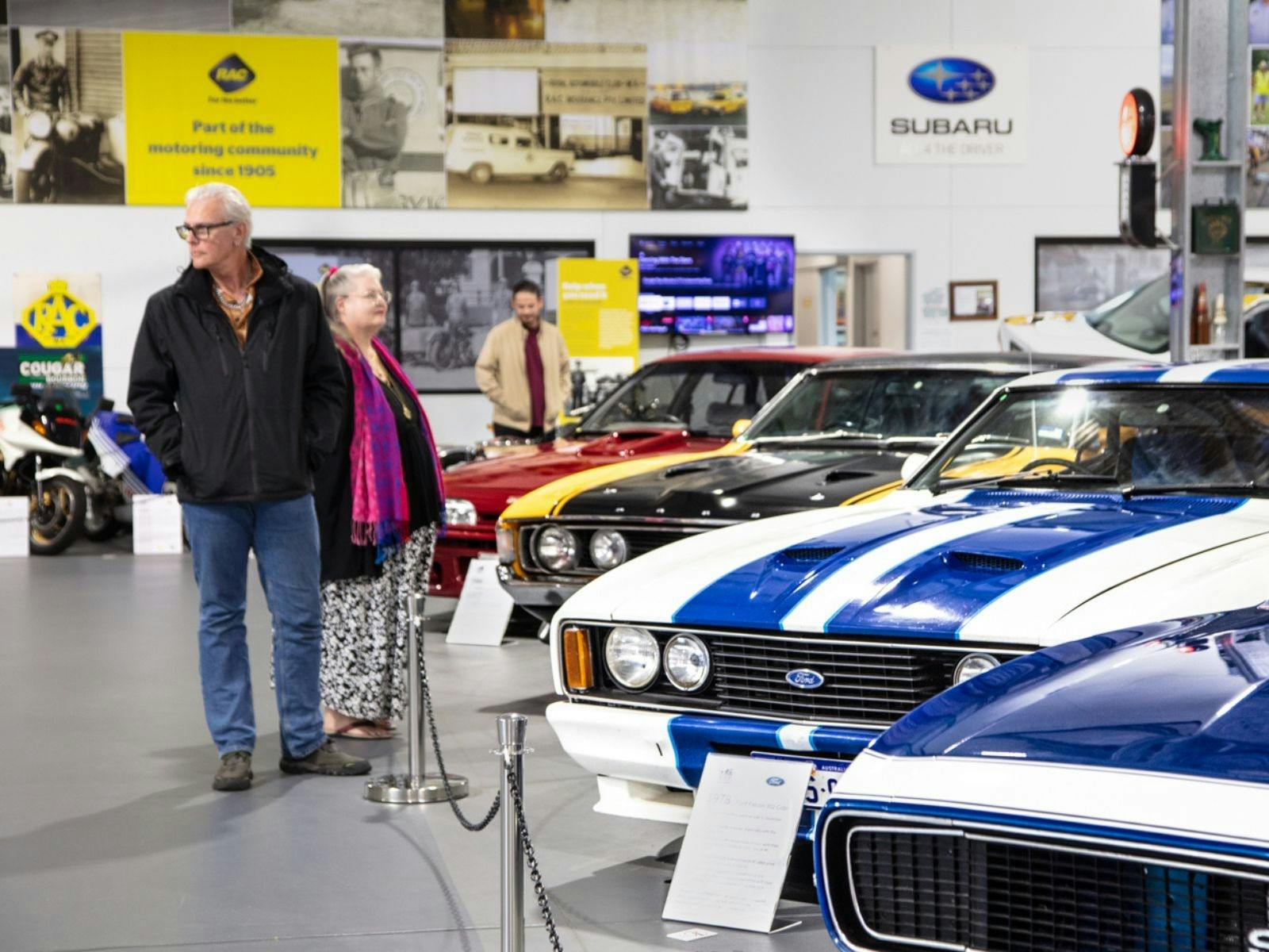 Couple looking at MMWA muscle car collection