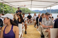 Full boat of guests as tour guide navigates the Daintree River looking for wildlife like Crocodiles