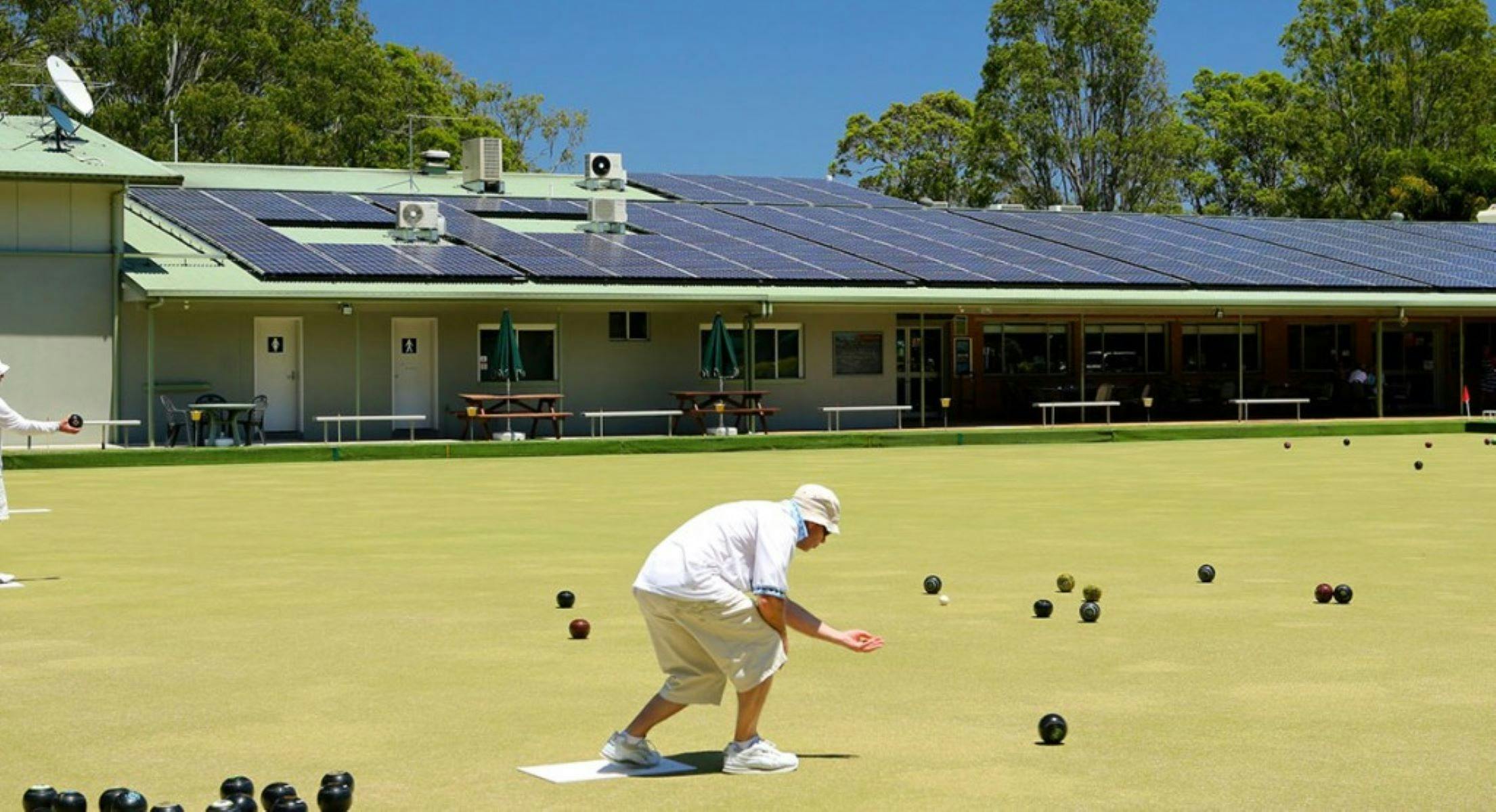Person bowling on green at North Beach Bowling Club