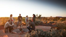 Watch the amazing transformation of colours and life as the desert awakens with Uluru as the backgro
