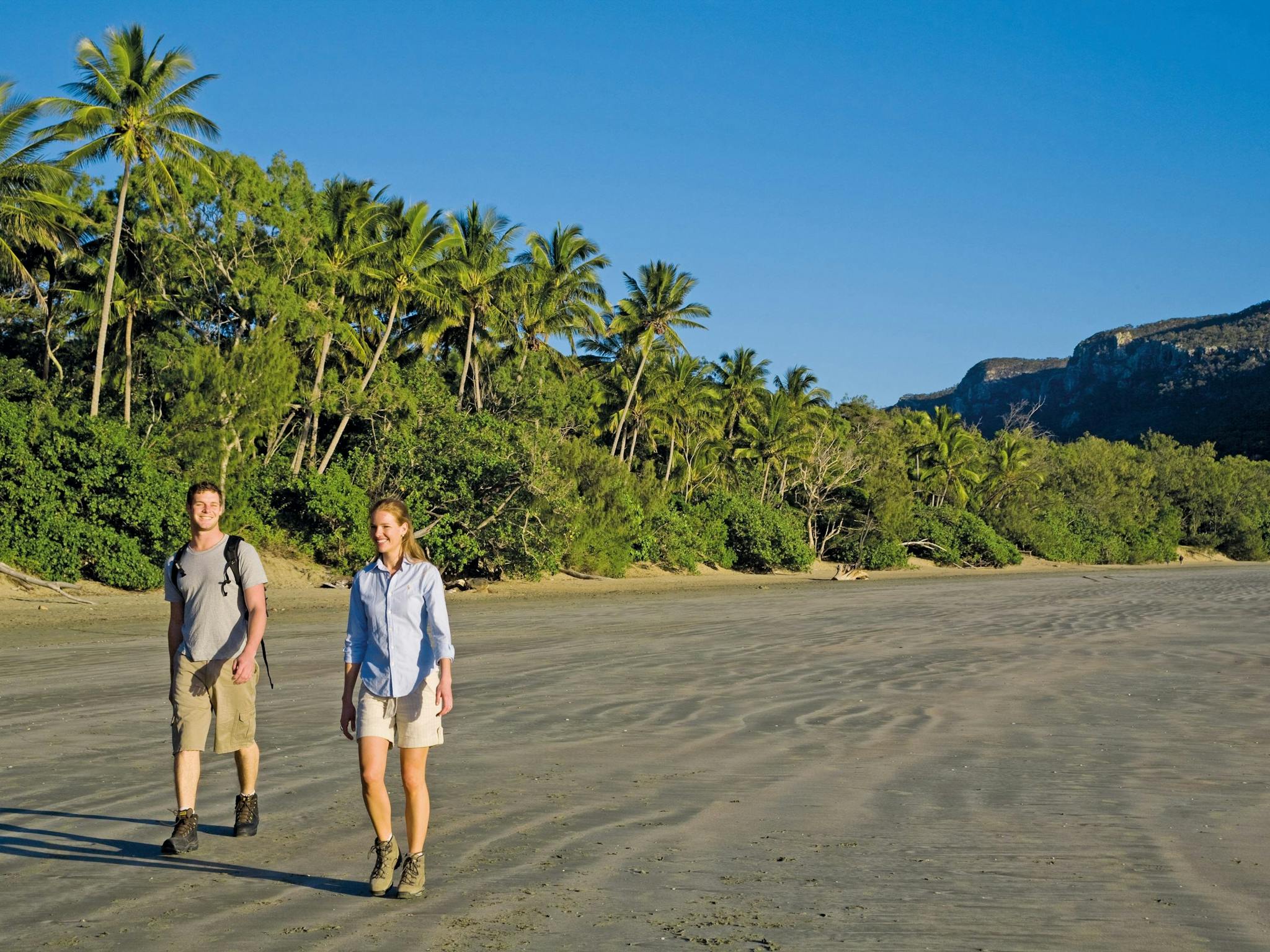 Walkers on beach at Cape Hillsborough