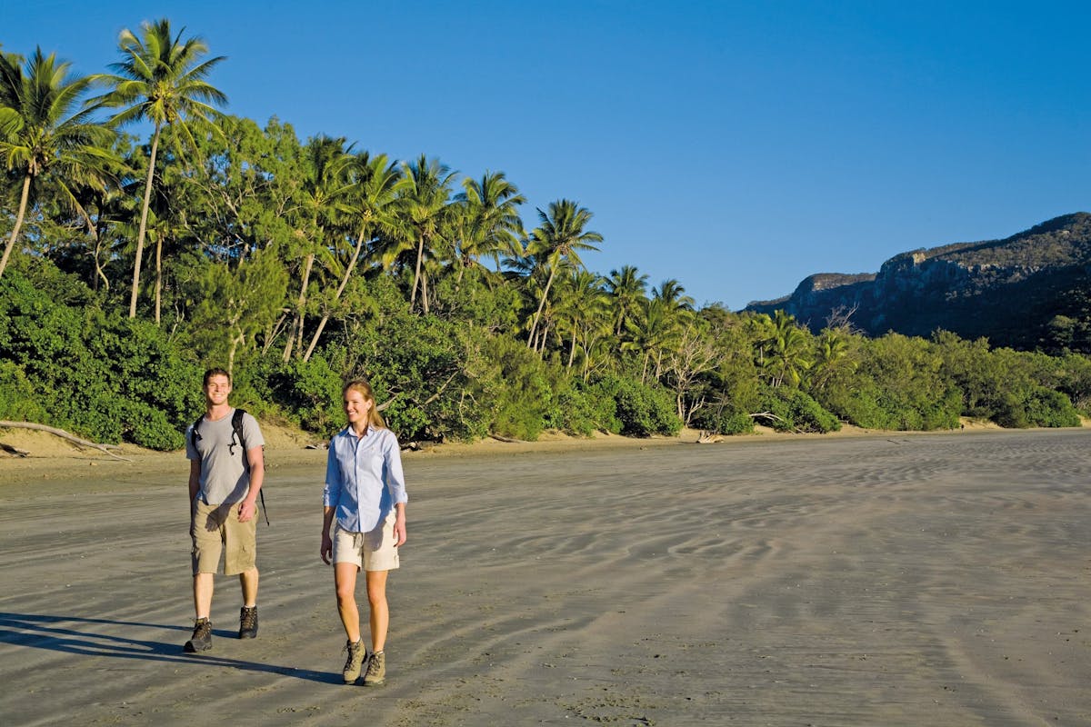 Walkers on beach at Cape Hillsborough