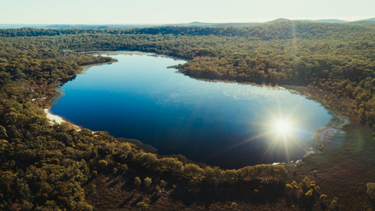 Aerial of entire Brown Lake Bummiera, on Minjerribah North Stradbroke Island Queensland