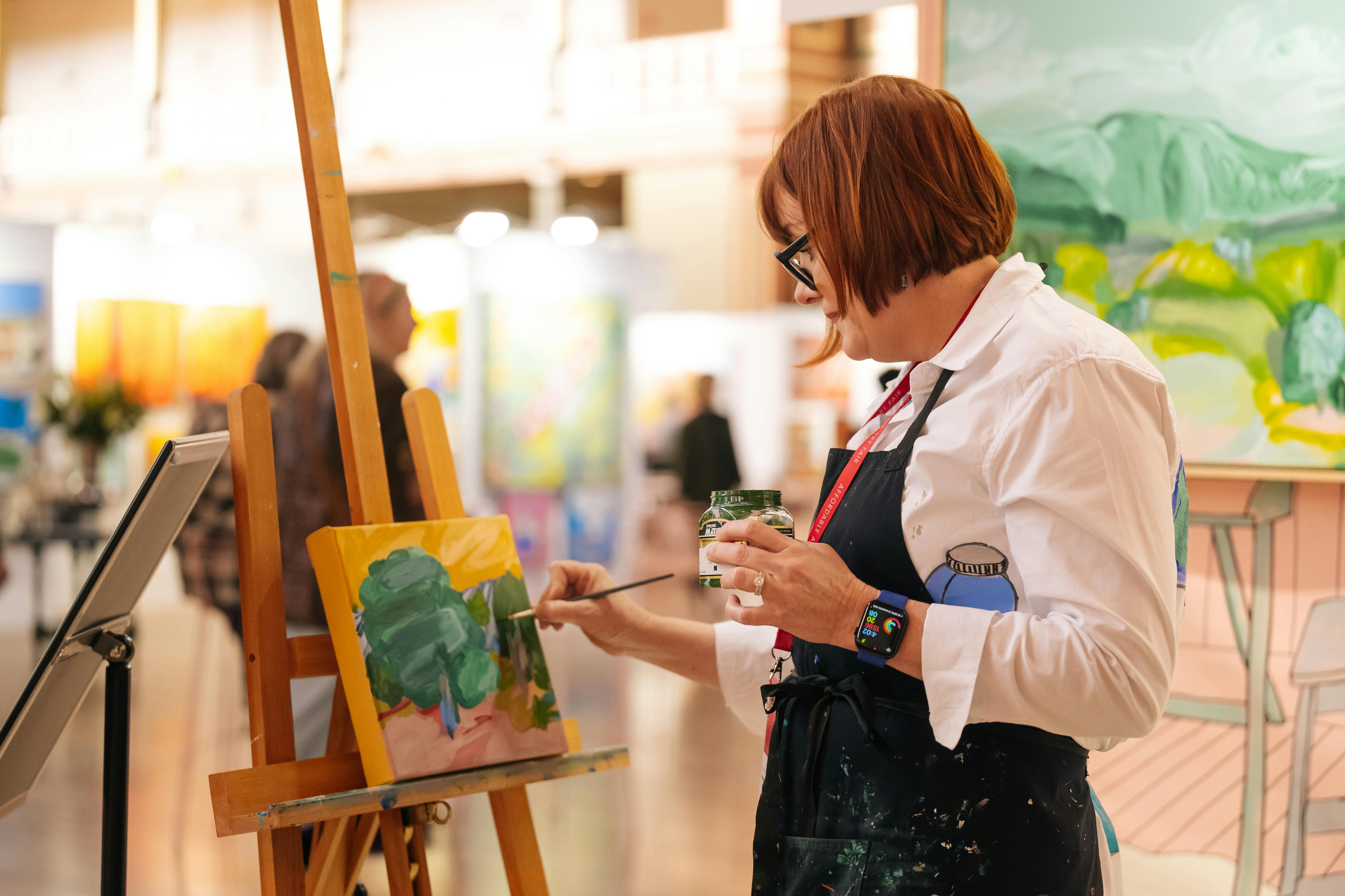 Image of artist painting at the fair