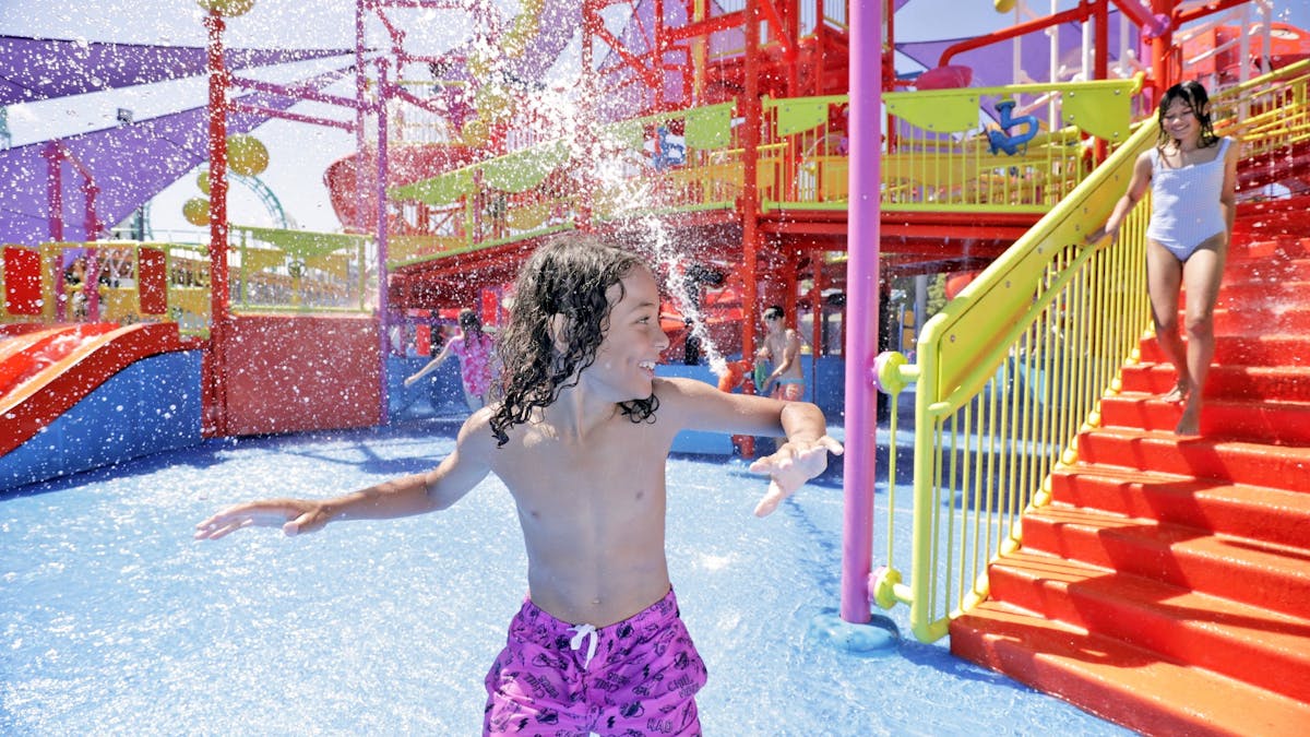 Child playing on Pipeline Plunge at WhiteWater World
