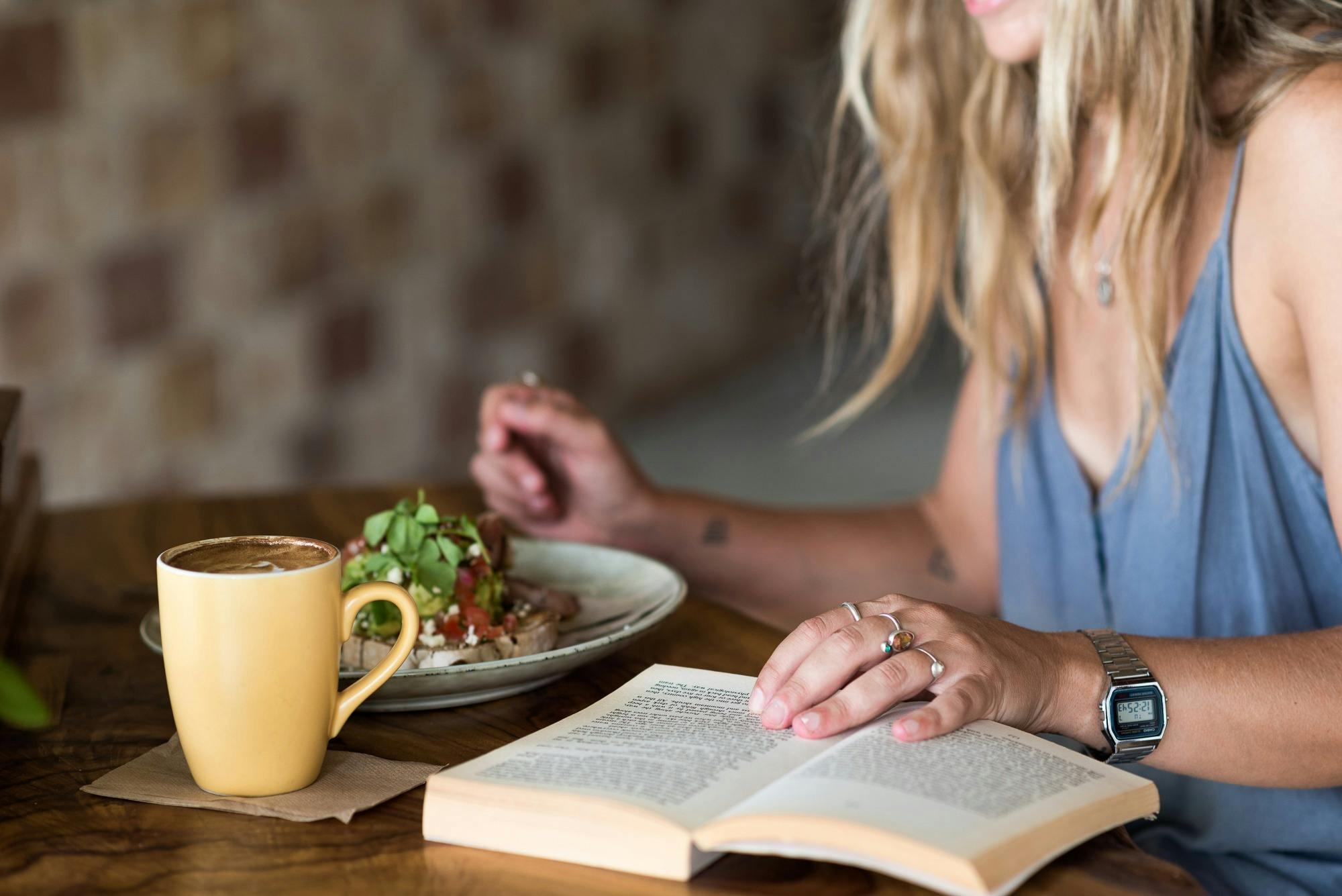 Person eating breakfast outside lodge