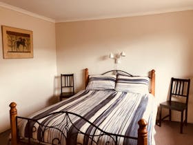 One of the bedrooms with a queen size bed