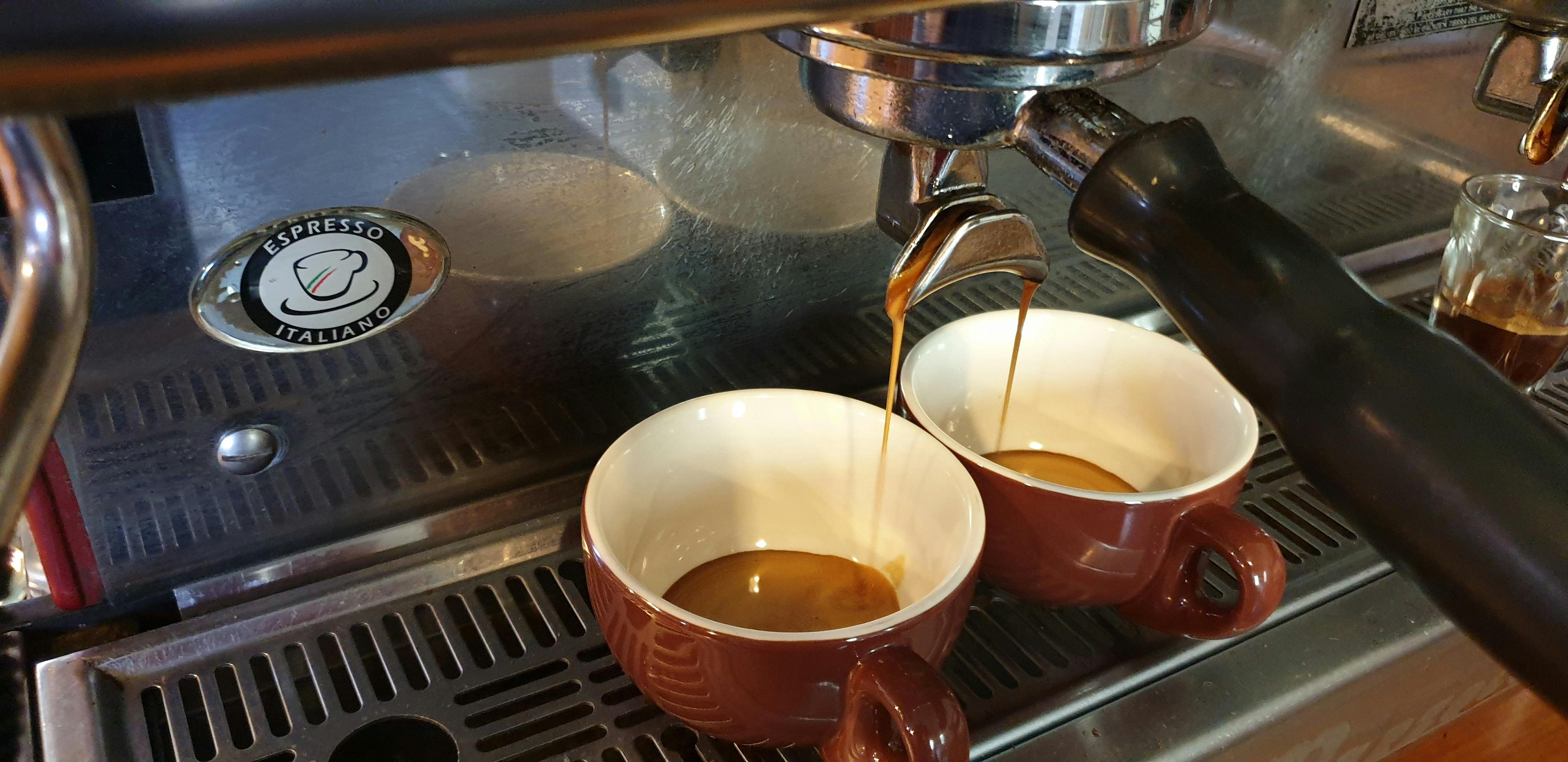 Coffee Machine in action pouring amazing coffee into our comfortable cups