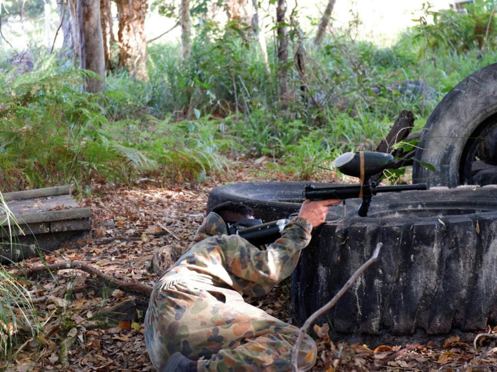 PLayer hiding behind tyre