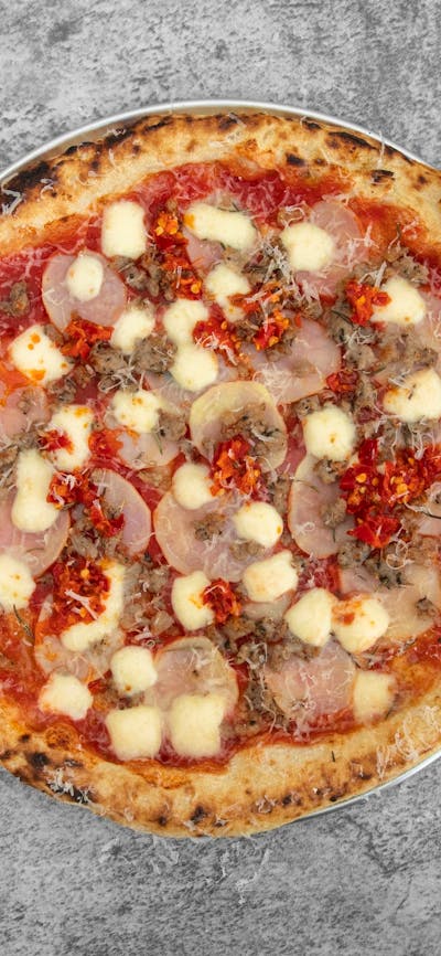San Marzano Tomatoes, Fior de latte, Italian sausage, Potato, Rosemary, finish with Spicy Hot Pepper