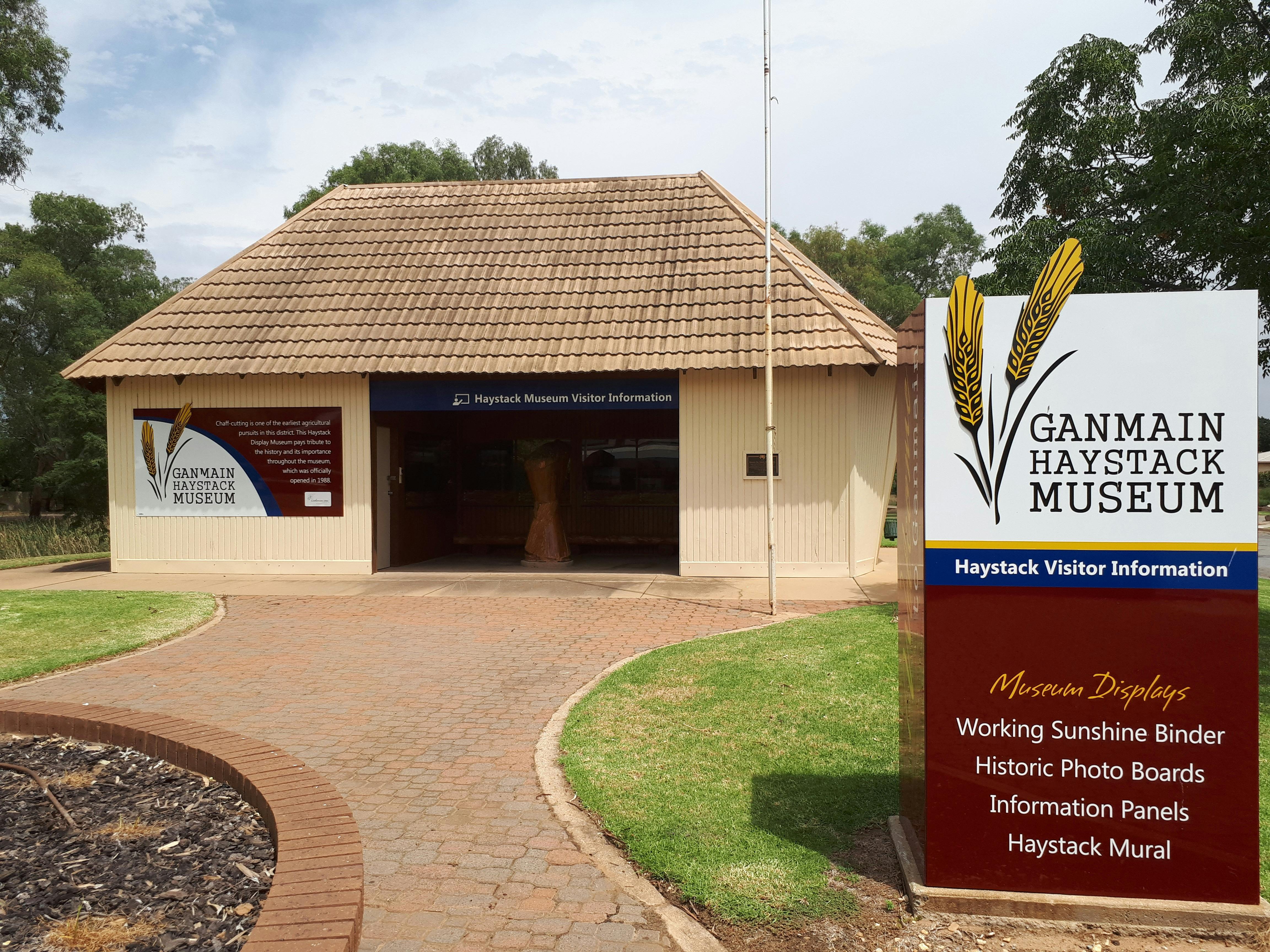 Sign saying hay display centre with building in the back ground