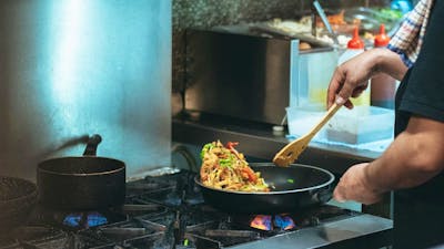 A meal being cooked on a stove