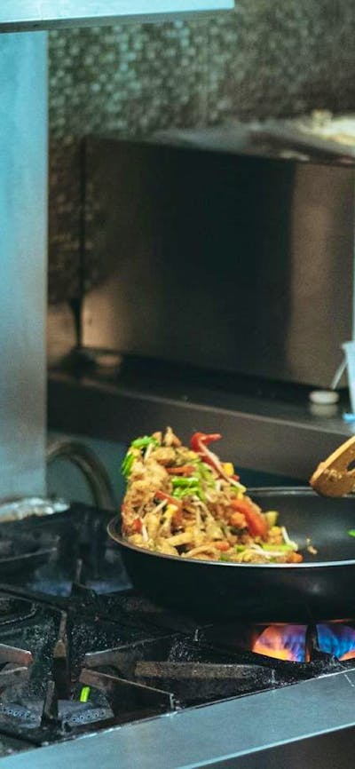 A meal being cooked on a stove