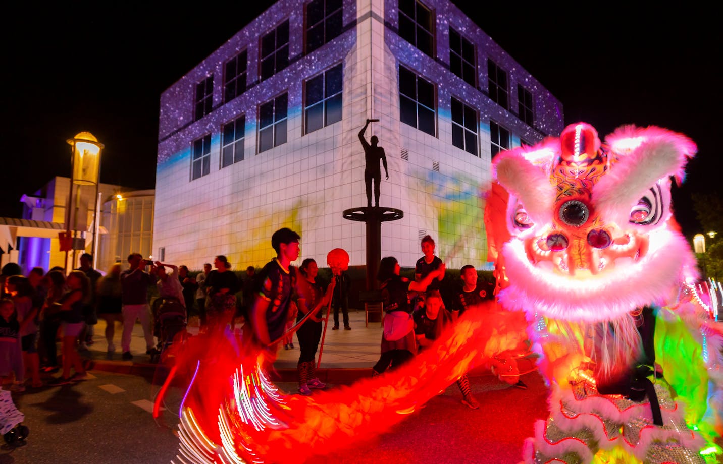 Questacon illuminated with Chines dragon dancers