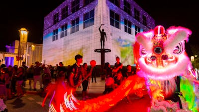 Questacon illuminated with Chines dragon dancers