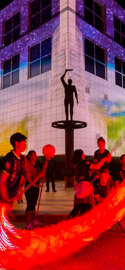 Questacon illuminated with Chines dragon dancers