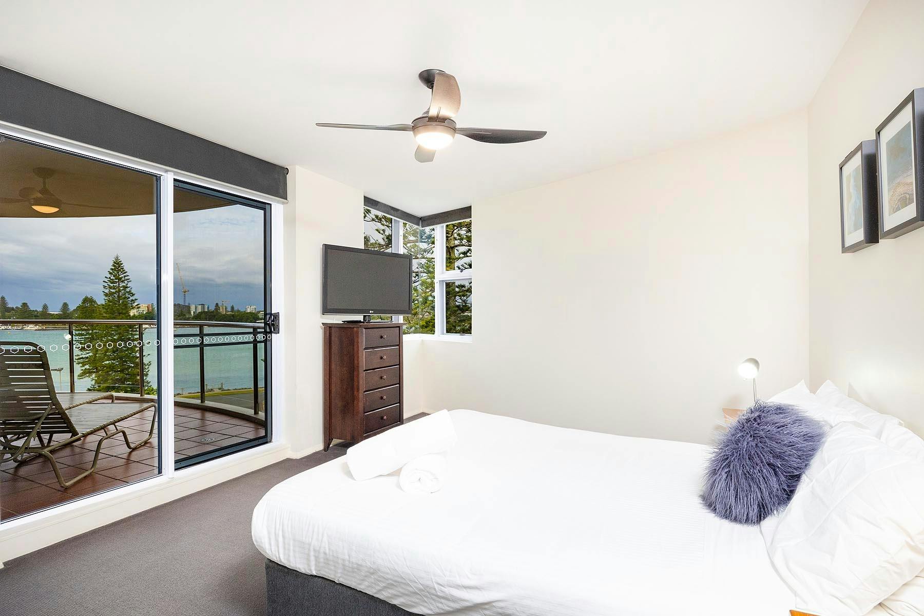 Master bedroom with views and balcony access