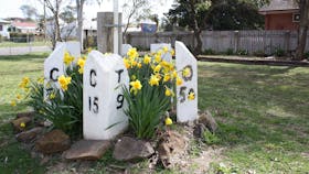 Mile posts and flowers