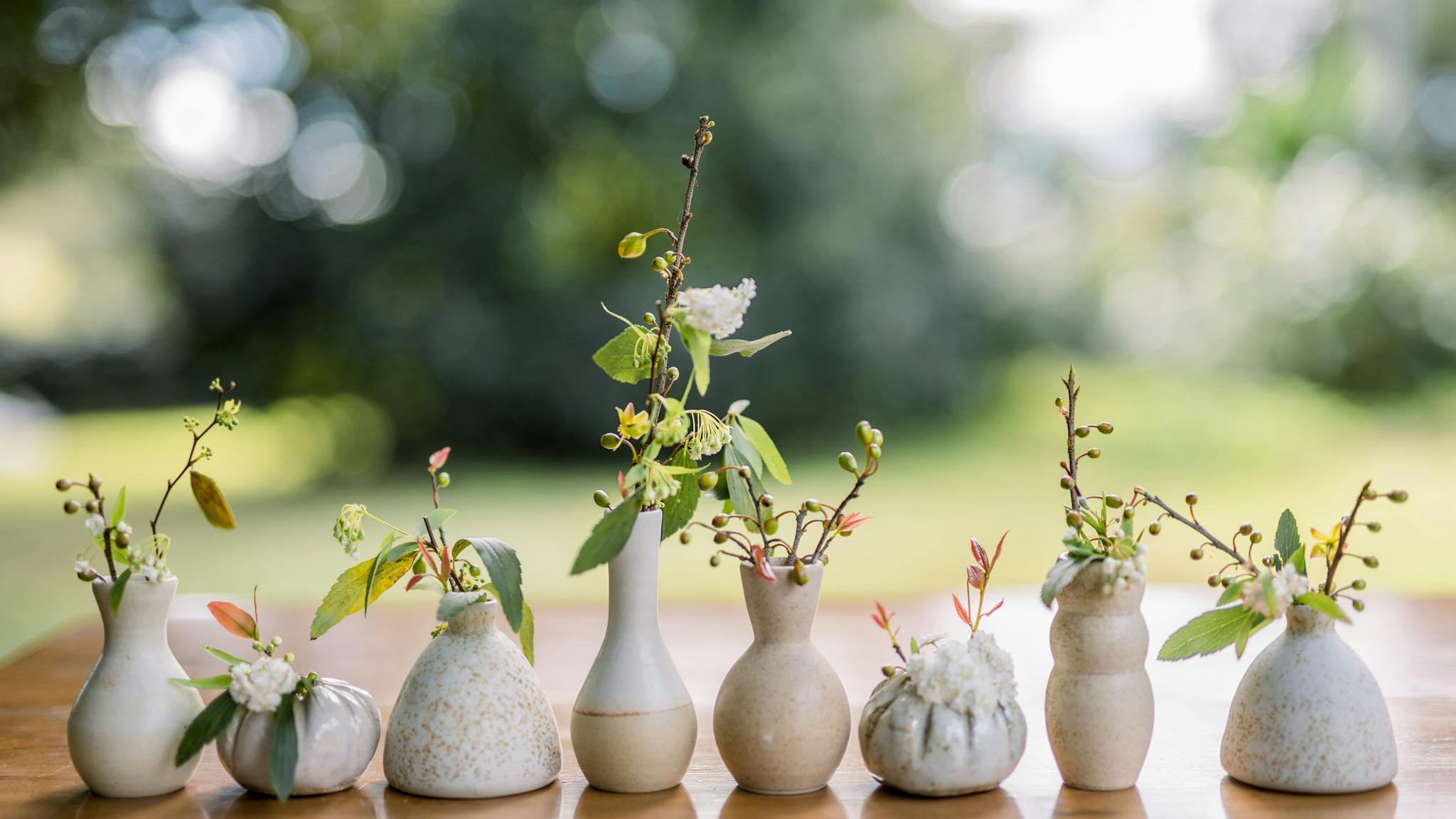 row of ceramic bud vases by Wedding Ceramics by PJ Pottery