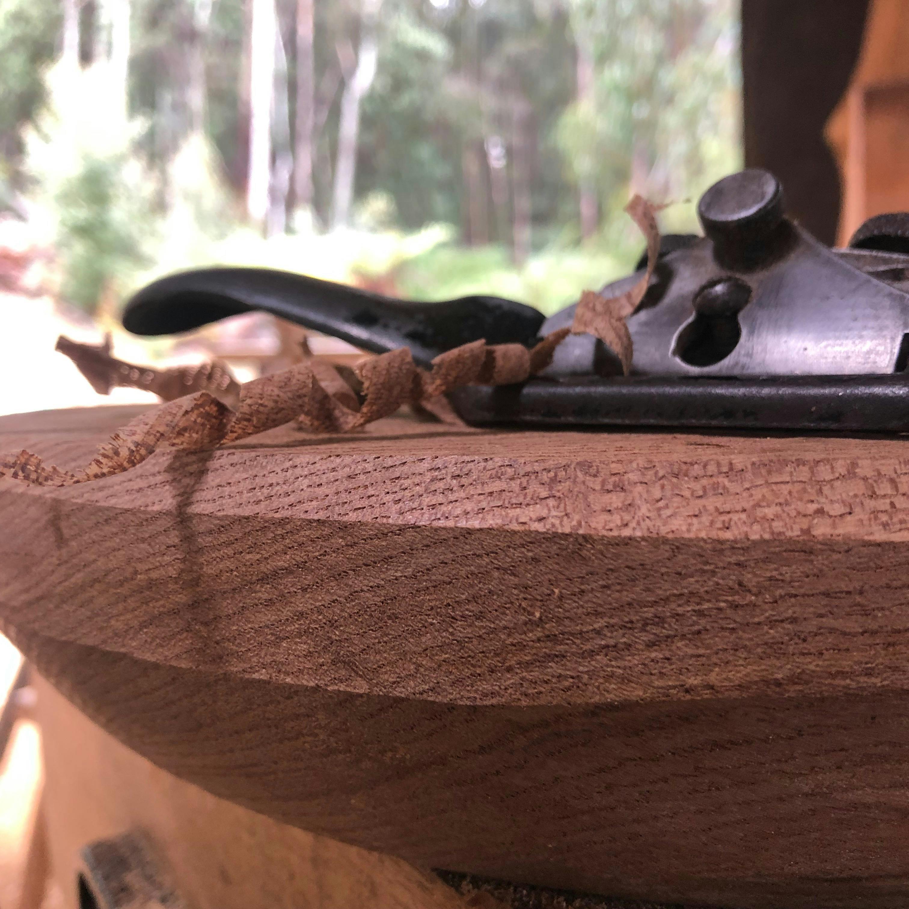 Sp[oke shave creating a Windsor chair seat at Wisdom Through Wood
