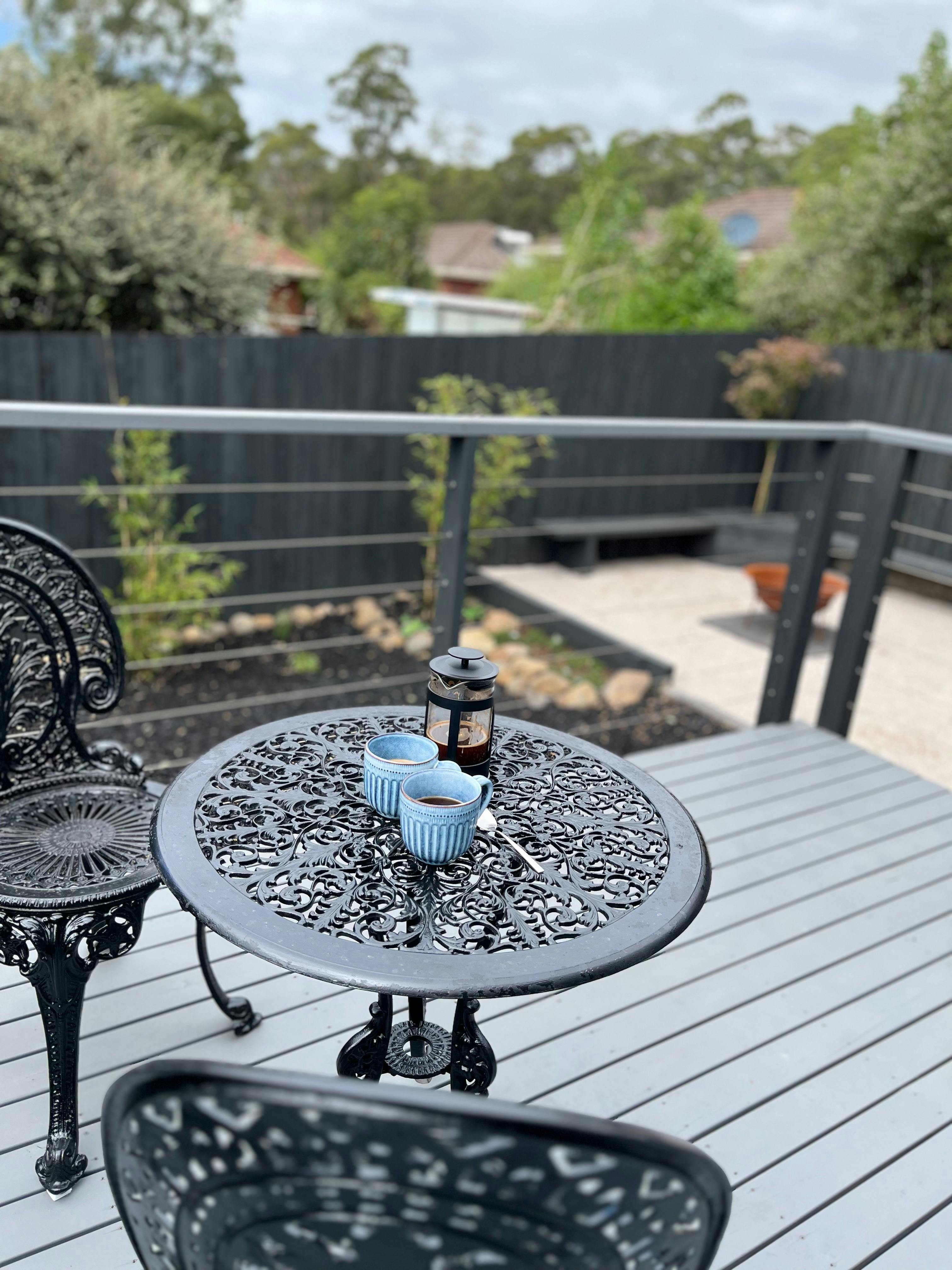 Backyard deck with seating space, firepit area with seating & BBQ