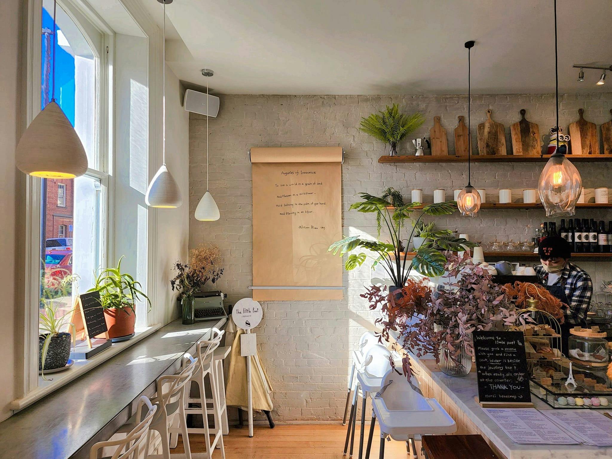 A corner of the little poet with the beautiful poem scroll at the counter.