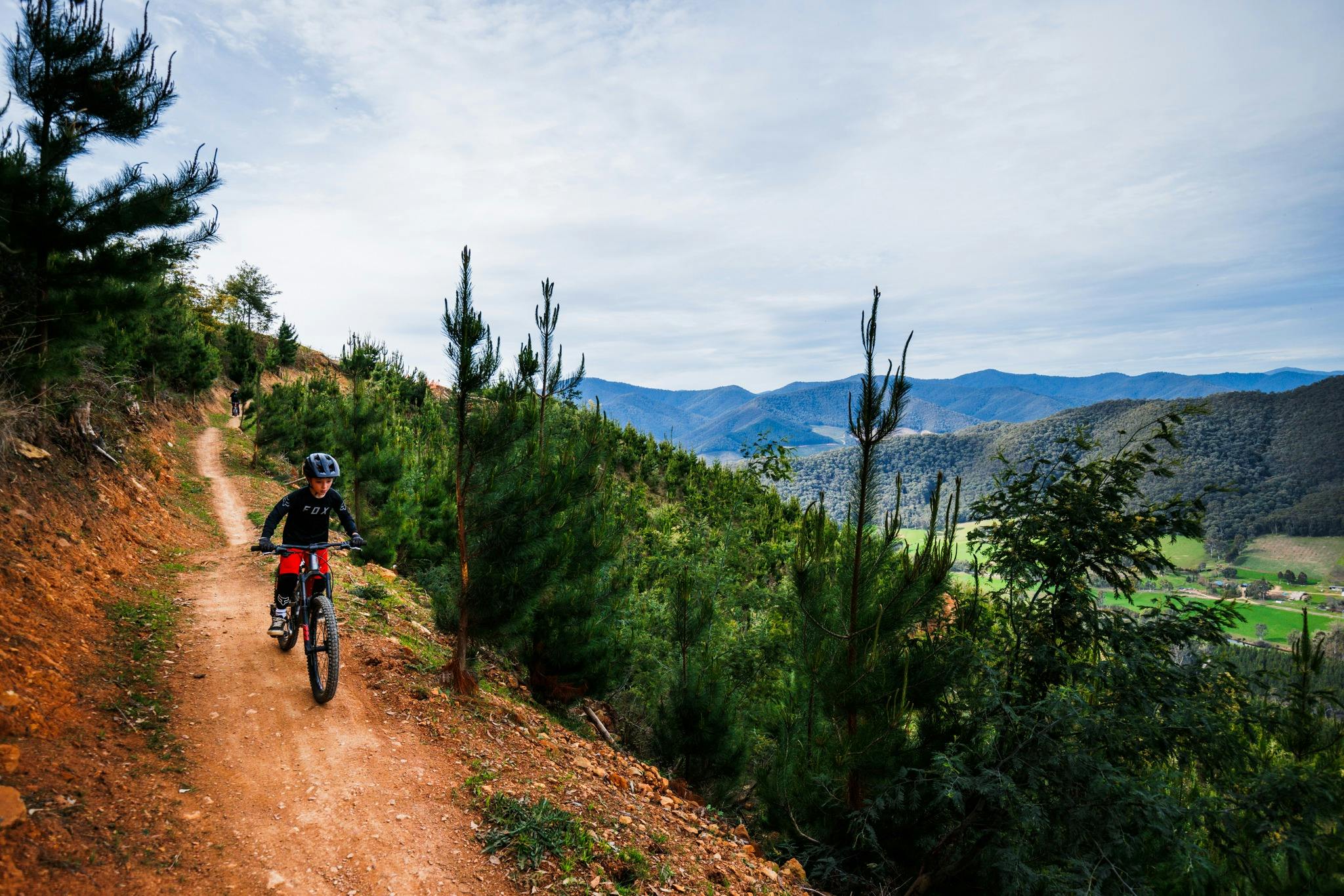 Rider at Mystic Bike Park Flowmingo Trail