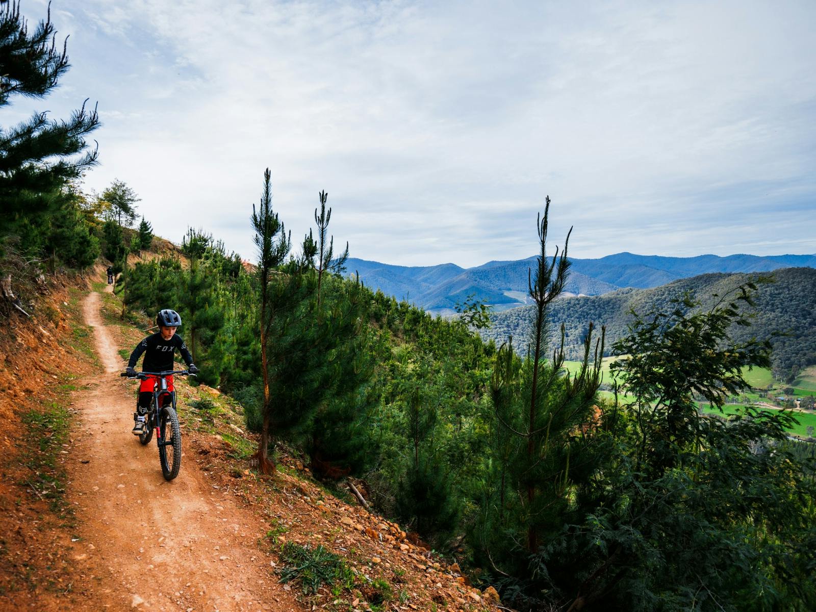 Rider at Mystic Bike Park Flowmingo Trail