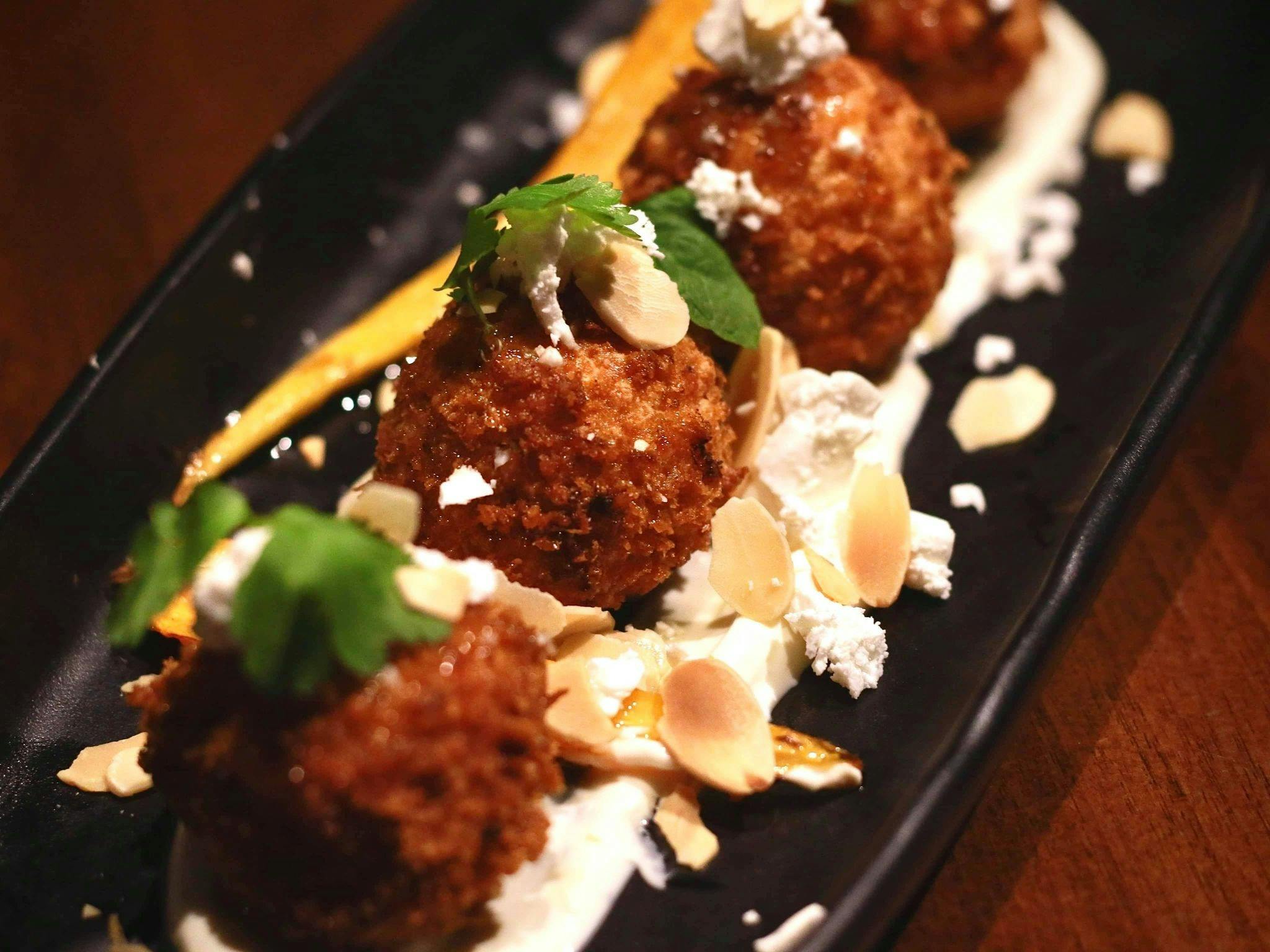 Tomato, Basil, feta, finished with truffle oil.