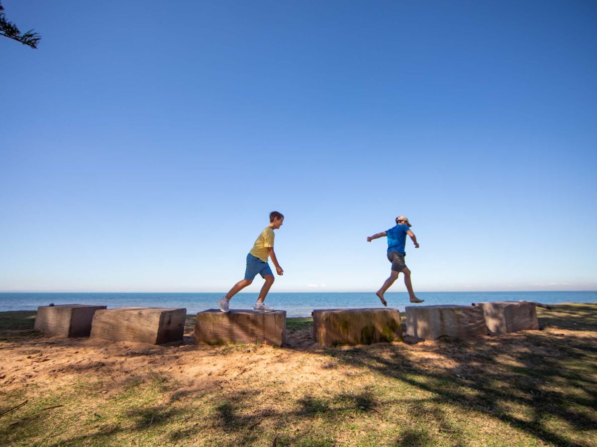Two children playing beachfront at Scarborough Beach Park Two children playing beachfront at Scarborough Beach Park