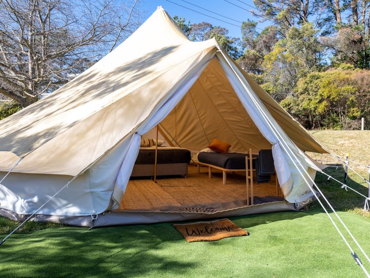 open glamping tent with bed inside