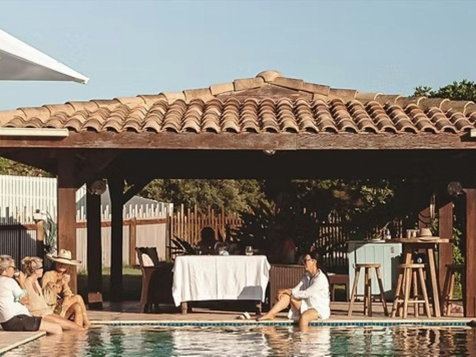 Women sitting by the resort pool