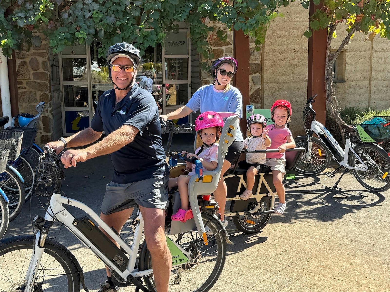 kids wearing pink helmets
